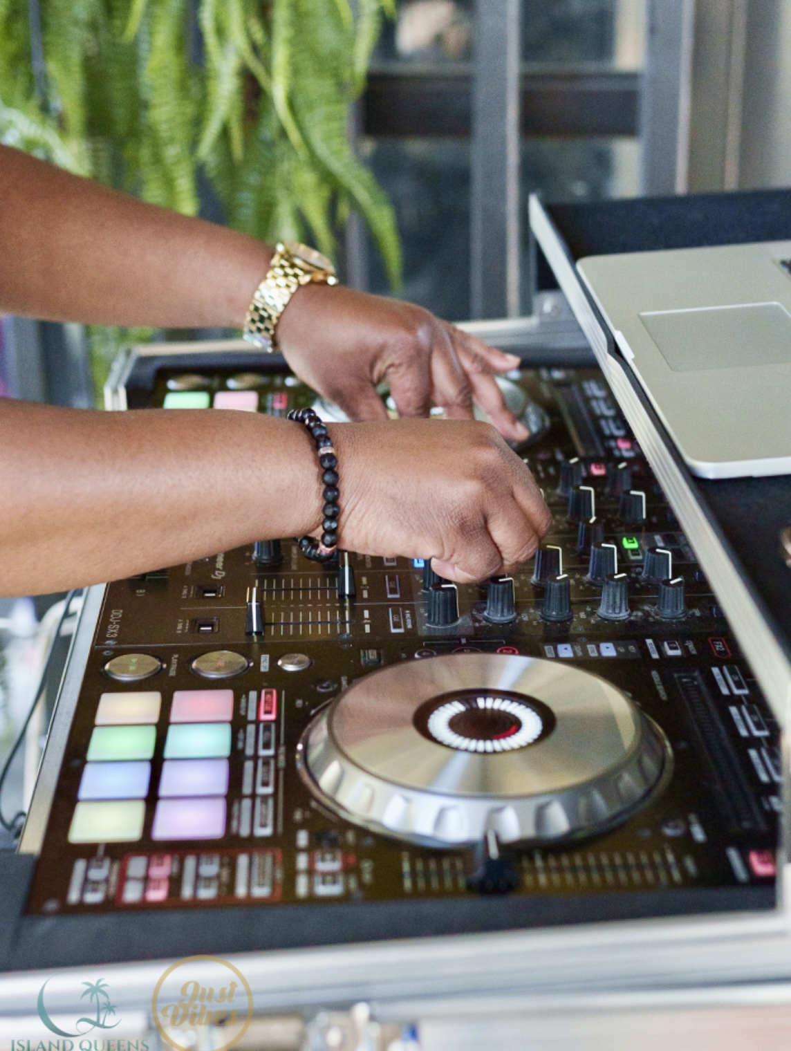Hands mixing on a DJ controller — real industry experience behind Bryan Strategy Lab